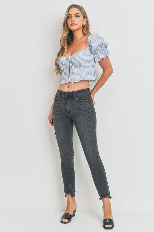 High-rise skinny jeans with distressed hem